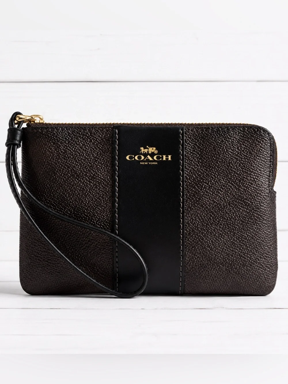 COACH corner zip wristlet in signature C pattern brown and black